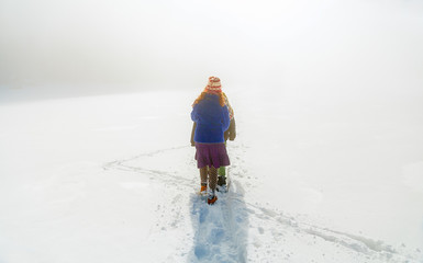 People alone in Winter. Beautiful mountain snowy landscape.