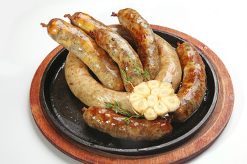 frying pan with homemade sausages