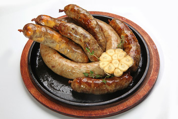 frying pan with homemade sausages