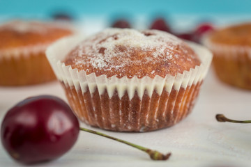 Closeup of muffin with fresh cherry