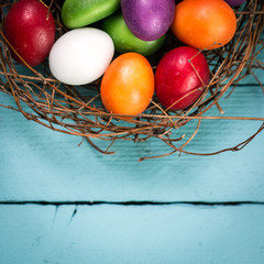 Easter concept with colorful eggs on wooden background