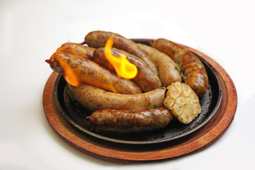 grilled sausages with flame