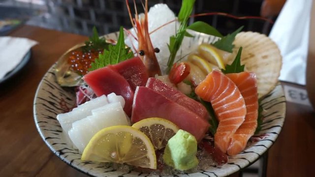 Japanese cuisine premium sashimi platter. salmon, tuna, scallop, shrimp, salmon roe, sea urchin and surf clam