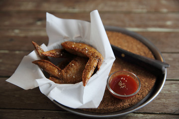 chicken wings on wood background