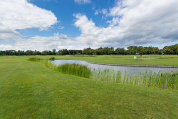 Fototapeta na wymiar Beautiful image of golf course with pond