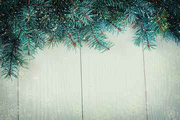 Christmas background with decorations on wooden board. Soft focus.