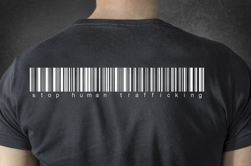 Stop human trafficking tittle and barcode on black t-shirt. 