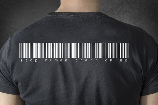 Stop human trafficking tittle and barcode on black t-shirt. 