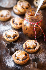 Traditional festive Christmas mince pies with a jar of homemade mincemeat and an empty tag
