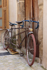 Fototapeta na wymiar Bicycle on the old street in the village Coaraze, France