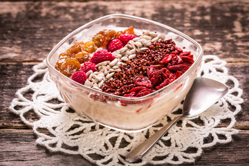 Breakfast banana smoothie bowl topped with goji berries,raspberry