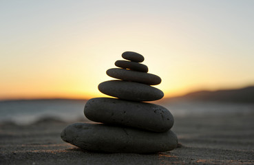 Zen stones on the sand