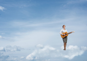 Businesswoman play guitar