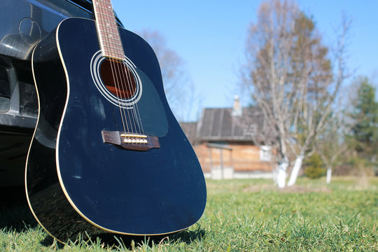 guitar outdoor near car