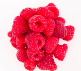 Raspberries: a stack of fruit on white background