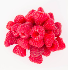 Raspberries: a stack of fruit on white background