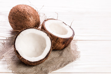 Coconut on wooden table.