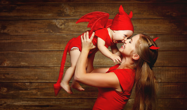 Family Mother And Baby Son Celebrate Halloween In Devil Costume