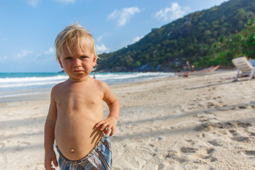 Portrait of little toddler on a beach