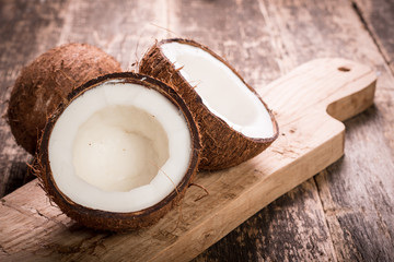 Coconut on wooden table.