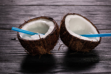 Coconut on wooden table.