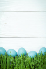 Easter concept with colored eggs on wooden background