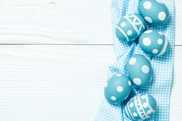 Easter concept with colored eggs on wooden background