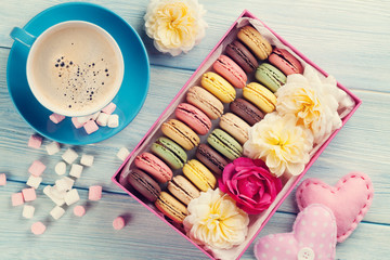 Macaroons and coffee. Sweet macarons in gift box