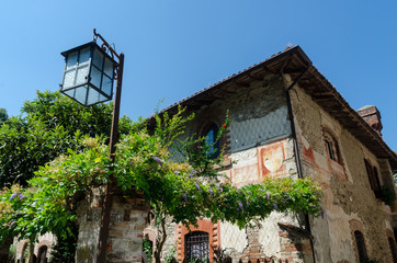 medieval house with lamp in Grazzano Visconti, Italy
