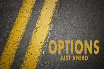 Fototapeta premium Options Just Ahead text on asphalt road.
