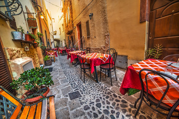 rustic tables and chairs by a trattoria