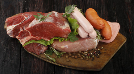 meat with spices on wooden background