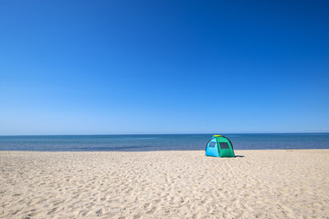Fototapeta na wymiar Tent on the Beach