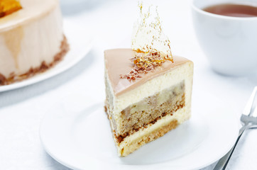 Banana caramel mousse cake with milk chocolate glaze