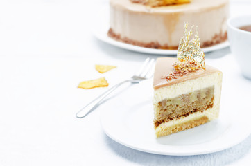 Banana caramel mousse cake with milk chocolate glaze