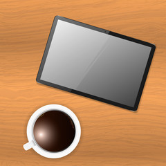 Vector tablet on wooden table and a cup of coffee