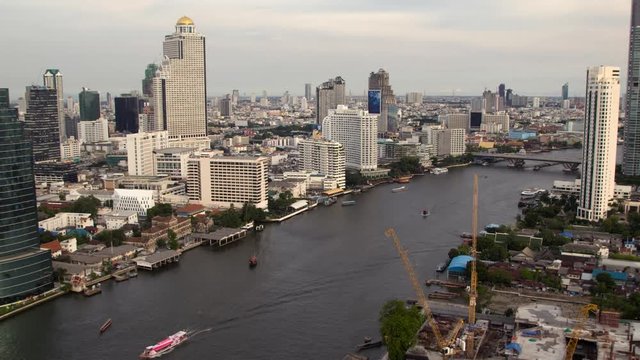 Day to night, Boat traffic on Chao Phraya river in Bangkok, Thailand, time lapse