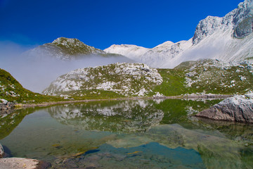 Naklejka na ściany i meble Glacial small lake Lužnica at Julian Alps, Krn, Slovenia, 