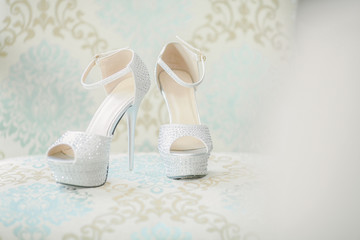 Fototapeta na wymiar Elegant and stylish bridal shoes. Shallow DOF and selective focus