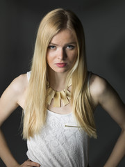 Naklejka premium young blonde women closeup portrait in studio