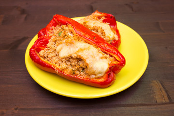 Peppers stuffed with cheese on a wooden table