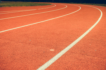Red running track in stadium.