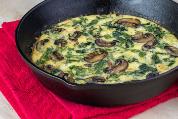 Fresh cooked spinach mushroom frittata.
