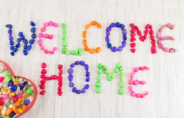 Welcome home note written with small rocks