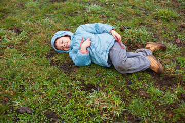 Boy lying on grass