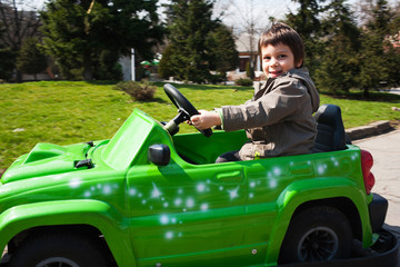  Little boy driving toy car