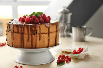 Cookie cake with melted chocolate and raspberries