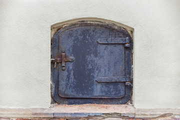 Old black rusty metallic door