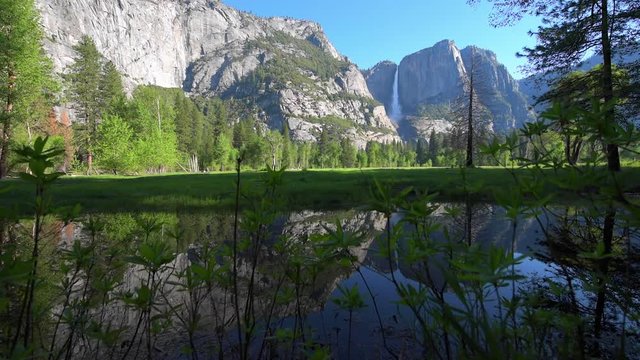 Yosemite Falls reflection in Merced River at Sunrise National Park, California