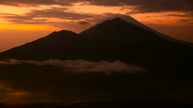 Sunrise over Lake Batur, Volcano Agung and Abang on the background. Bali Indonesia.